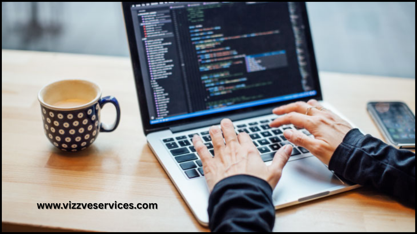 Developer coding clean, efficient code on a laptop in a neat workspace